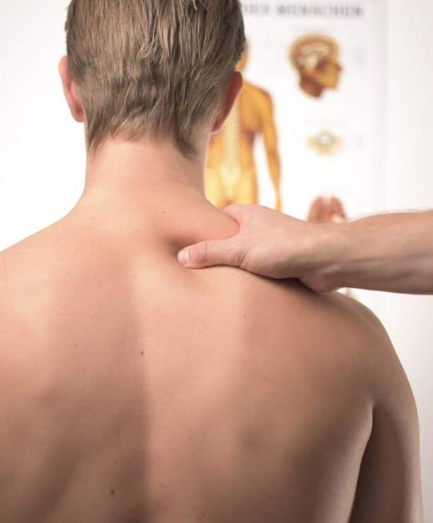 Shoulder Pain Chiropractic Treatment on Blonde Man